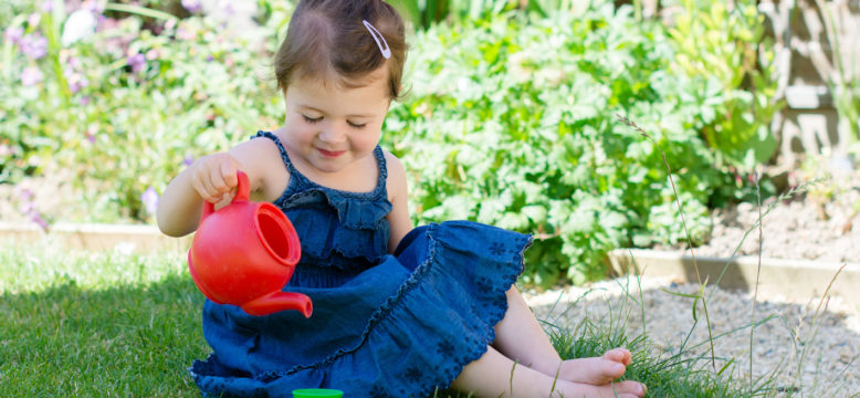 Child grounding feet outside on grass